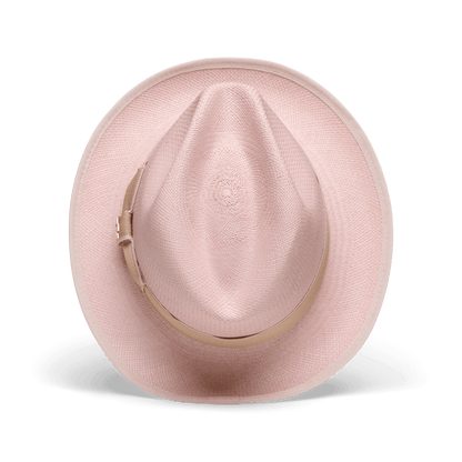 The Hartman by Goorin Bros. is a light pink straw fedora made from 100% toquilla, featuring a beige grosgrain hat band, shown from above on a plain white background.