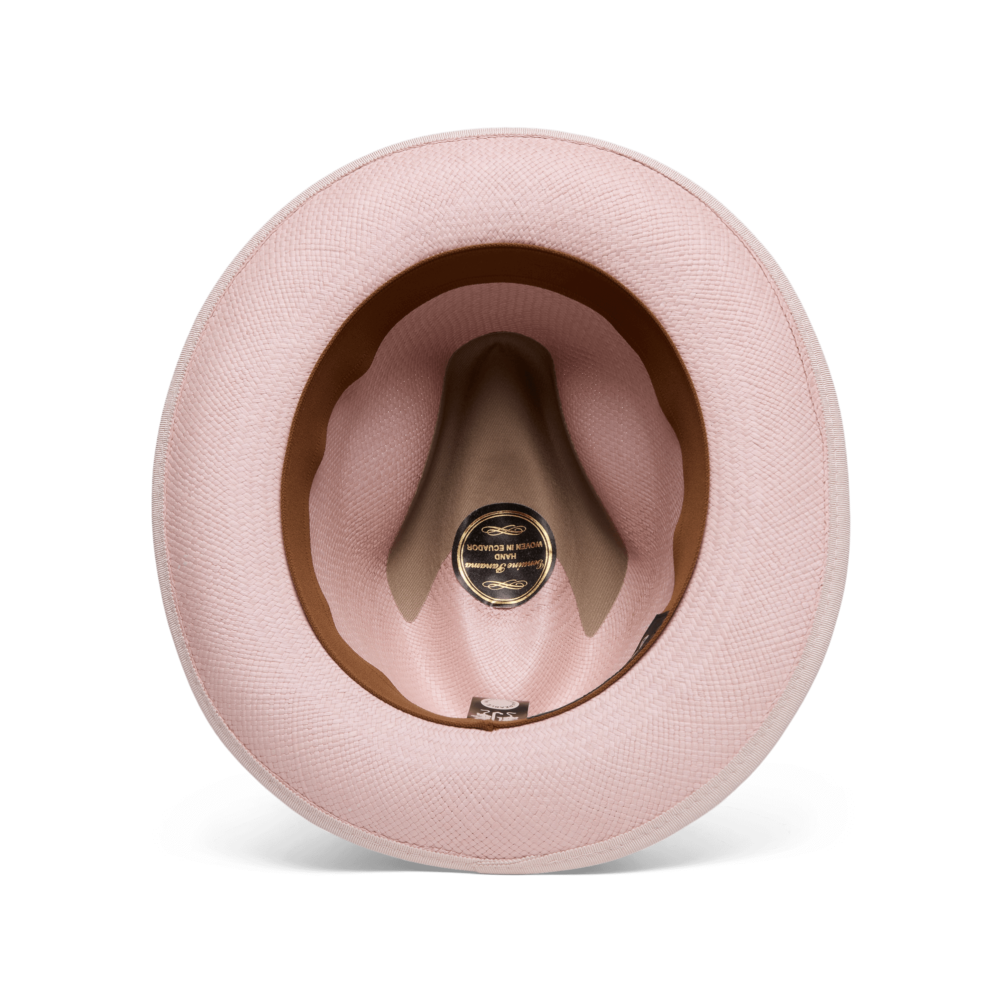 A top-down view of the Hartman by Goorin Bros., a pink hat showcasing its interior with a brown grosgrain hat band, contrast edge binding, and a black and gold label at the center.