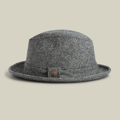 The Goorin Bros. Shady Tweed Fedora is a gray tweed bowler hat with a narrow brim and a small round metal button on the side, shown against a plain background.