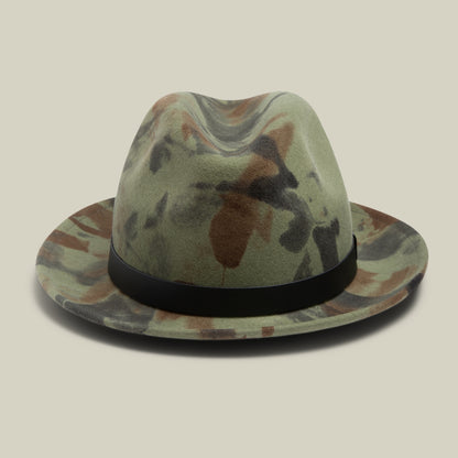 Dean the Butcher by Goorin Bros. is a camouflage fedora with a black grosgrain hatband, shown against a beige background.