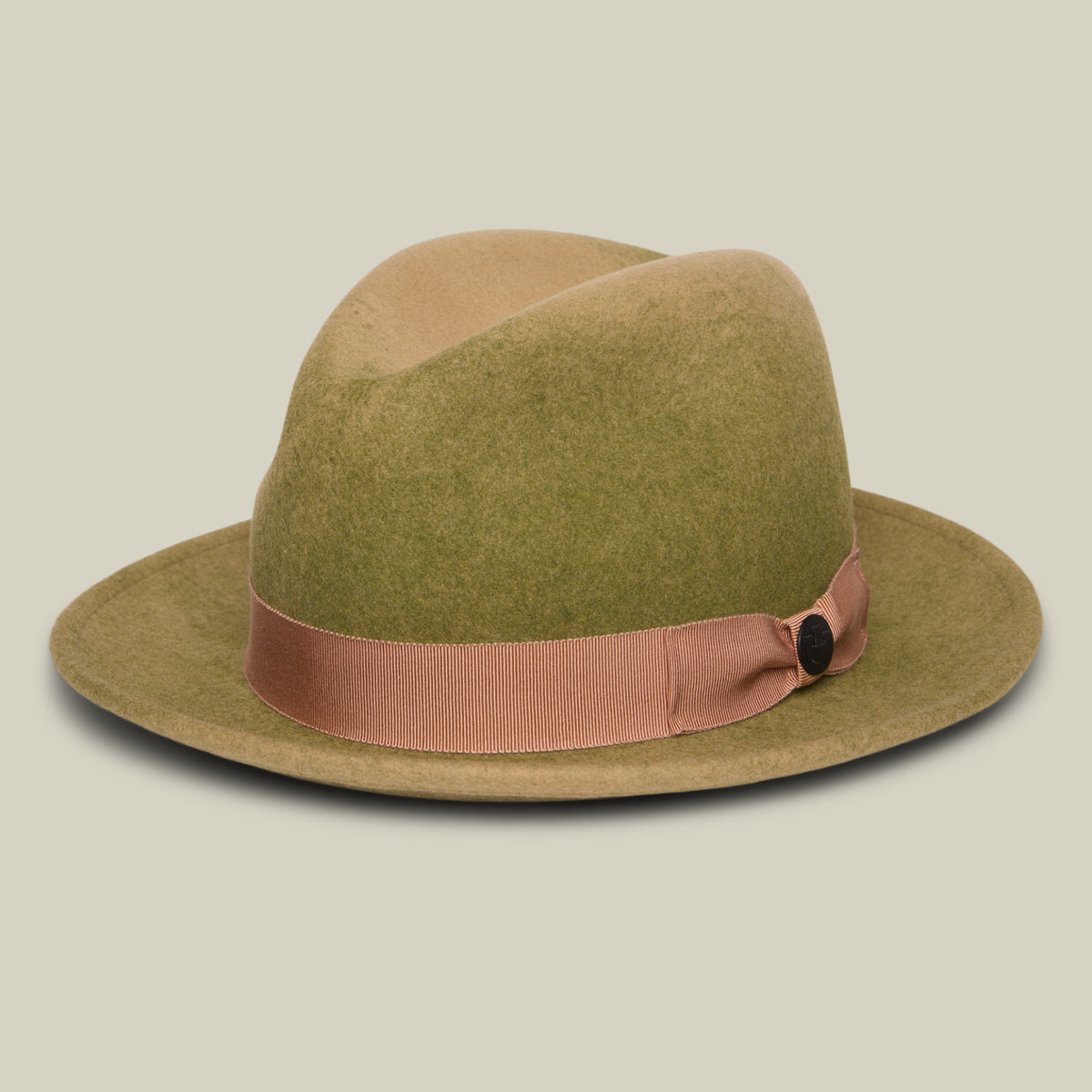 Dean the Butcher by Goorin Bros. is a green felt, American-made fedora featuring a wide brim and a light brown grosgrain hatband, pictured against a plain off-white background.