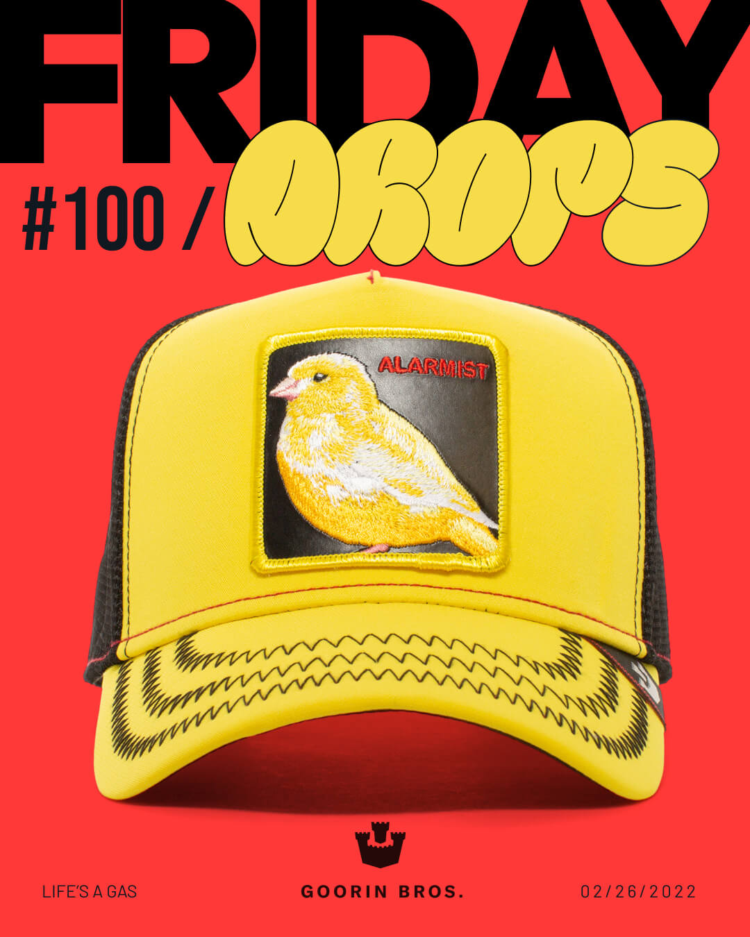 A yellow and black Goorin trucker hat with a patch featuring a yellow bird and the word ALARMIST, displayed on a red background with bold text reading FRIDAY DROPS #100. Perfect for fans of stylish, durable hats.