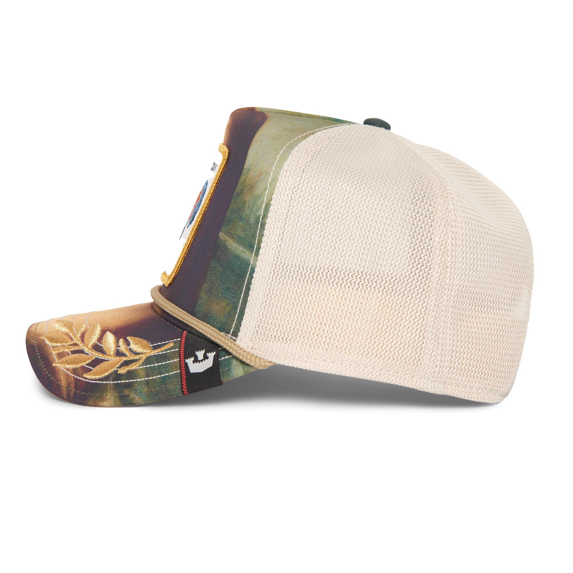 Side view of The Farm's Sicut Mentula beige mesh hat with embroidered, patterned brim and a decorative front patch.