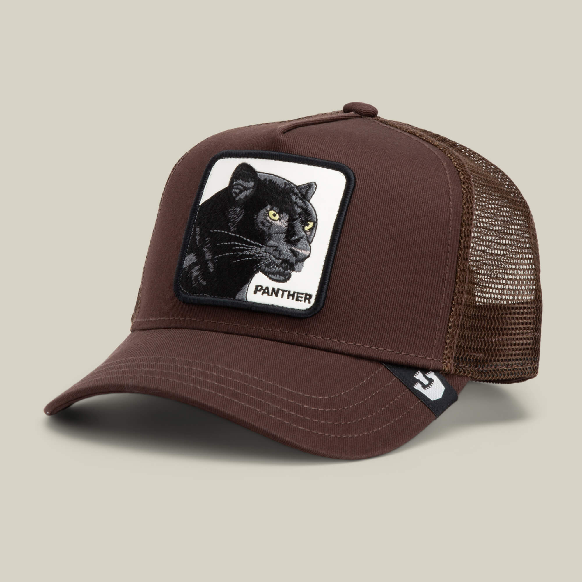 The Panther trucker hat by Goorin Bros. is a brown mesh baseball cap featuring a front patch with a black panther and the word "PANTHER.
