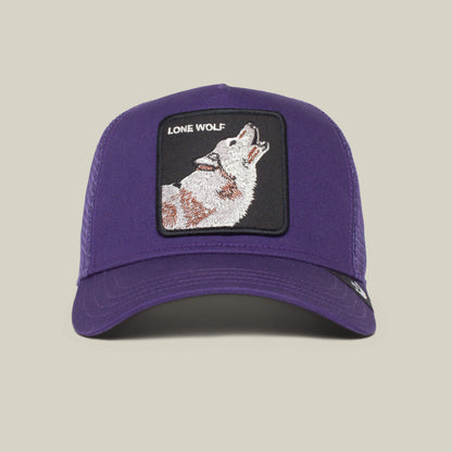 The Lone Wolf by The Farm is a purple trucker hat featuring a front patch with a howling wolf and "LONE WOLF" text—ideal for independent spirits and true anti-conformists.
