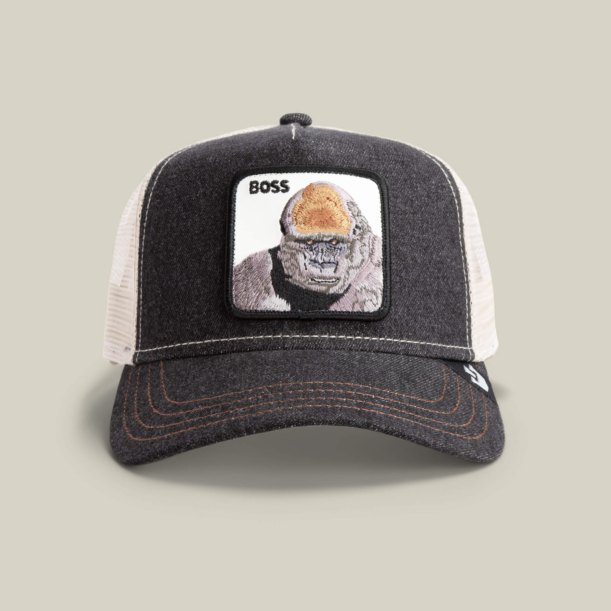 The Farm's "The Boss" trucker hat features a mesh back and a front patch with an illustrated 800-pound gorilla and the word "BOSS" above it.