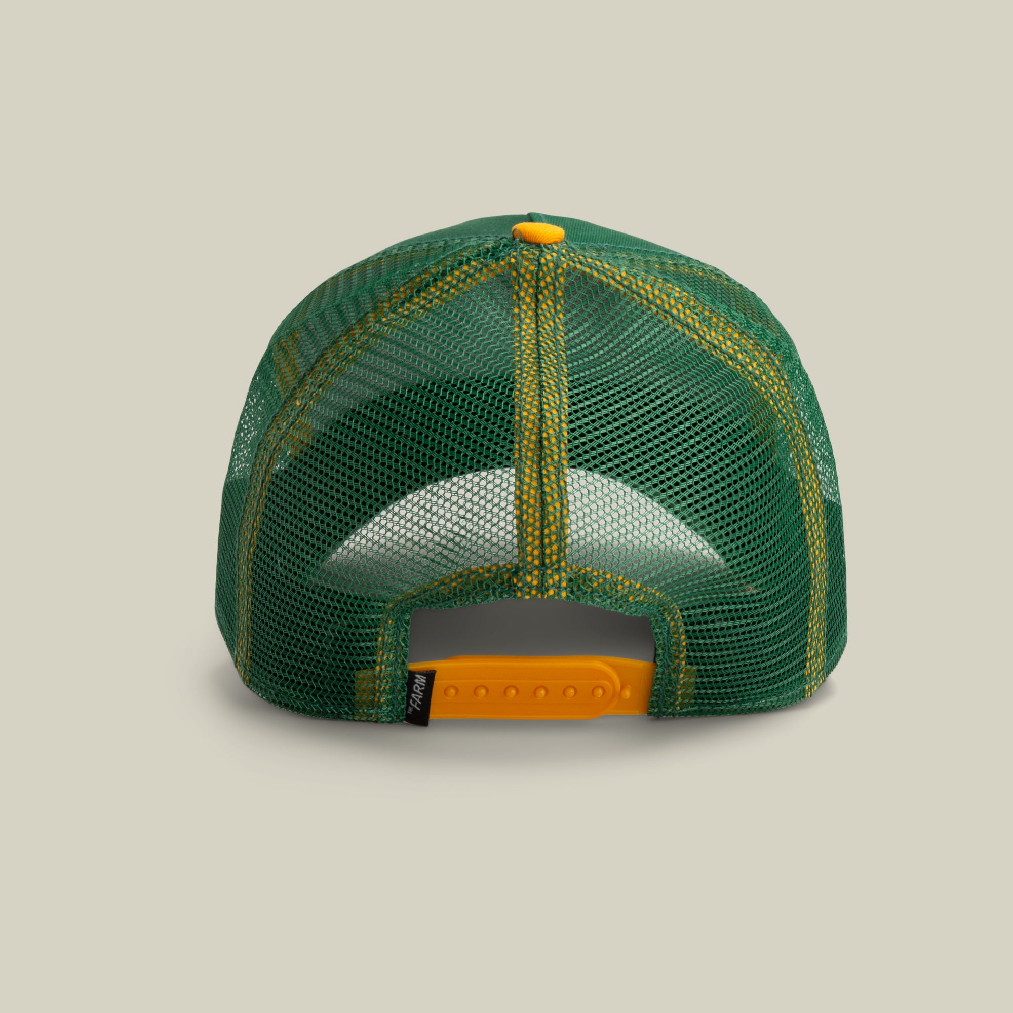 The Bulletproof Rhino by The Farm: green and yellow mesh back baseball cap shown from the rear, with an adjustable yellow snapback closure. All sales are final.