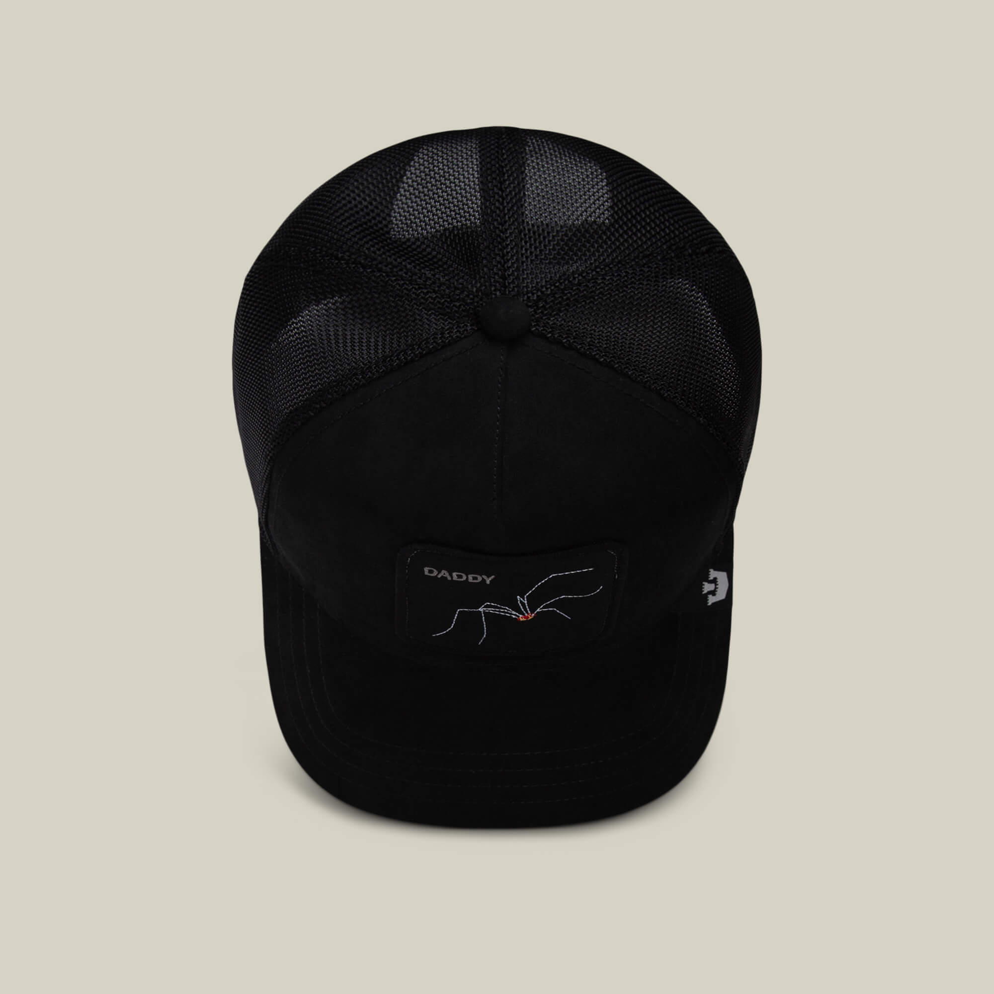 The Suede Spider by Goorin Bros. is a black mesh trucker hat featuring a DADDY patch and an embroidered spider—makes a funny dad gift for any occasion.