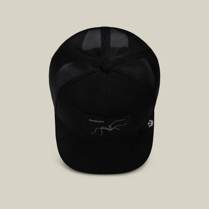 The Suede Spider by Goorin Bros. is a black mesh trucker hat featuring a DADDY patch and an embroidered spider—makes a funny dad gift for any occasion.