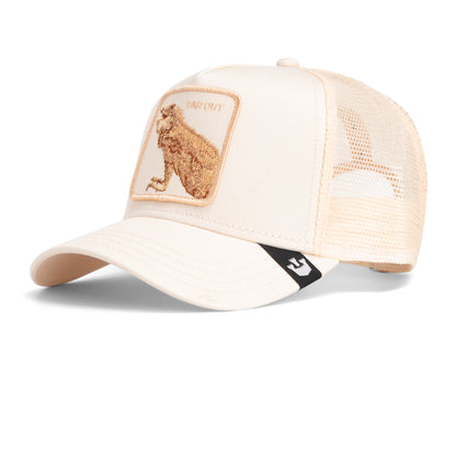 The Far Out Mirage by Goorin Bros. is a beige mesh trucker cap with a curved brim and a front patch featuring an embroidered bear and "FAR OUT," inspired by the monochromatic style of the Chroma Wave collection.