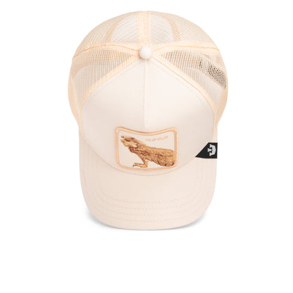 The Far Out Mirage by Goorin Bros. is a beige mesh trucker hat from the Chroma Wave collection, featuring a wolf patch with "PAW OUT" text and golden hues for a bold, monochromatic look.
