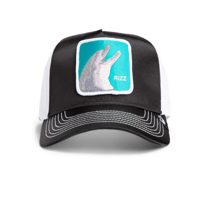 A black and white trucker hat with a patch showing a white rabbit hand shadow and the word RIZZ on a teal background, featuring bold hat designs inspired by classic Americana style.