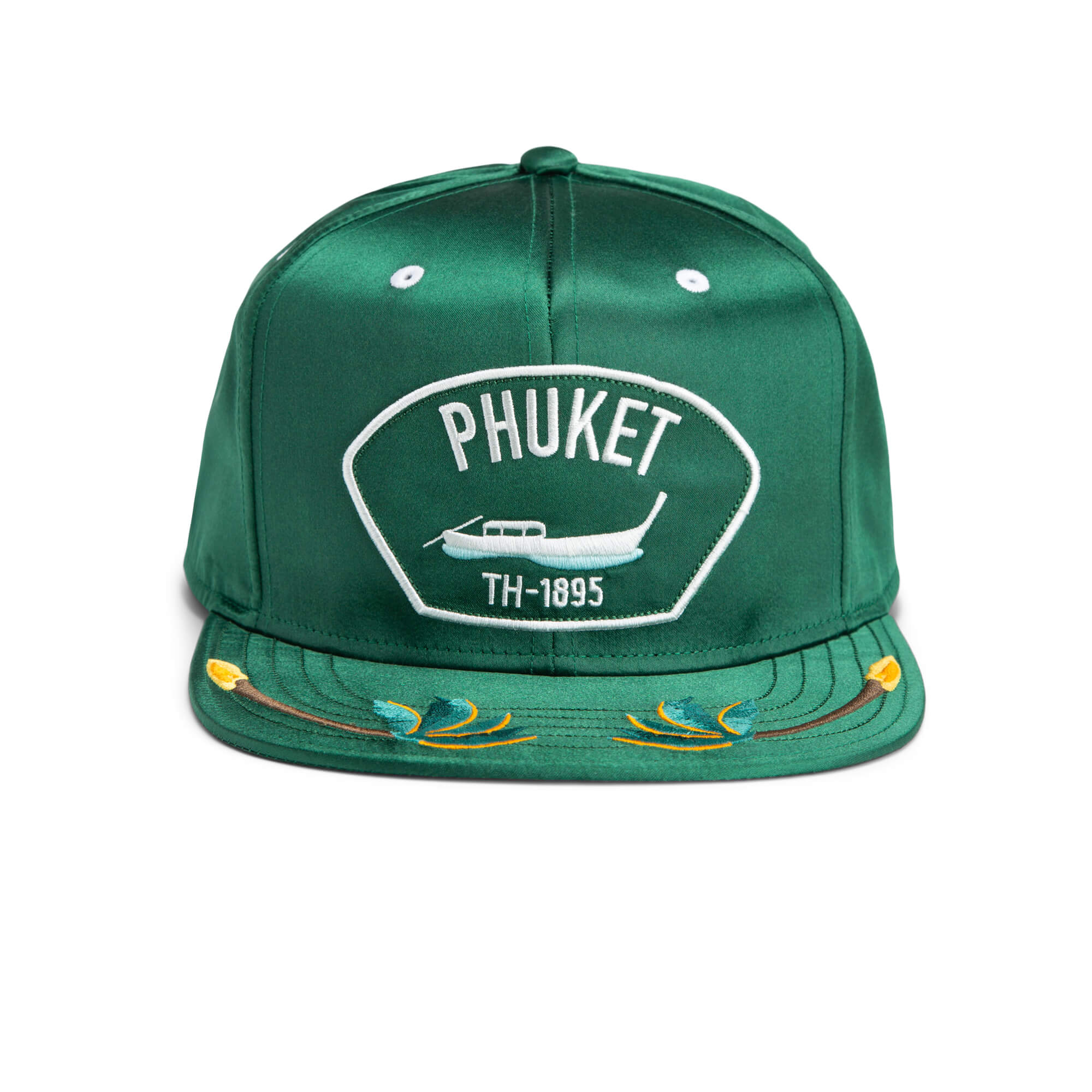 Green baseball cap with Phuket, an airplane graphic, and TH-1895 embroidered on the front, plus decorative stitching on the brim—a durable hat inspired by classic American made style.