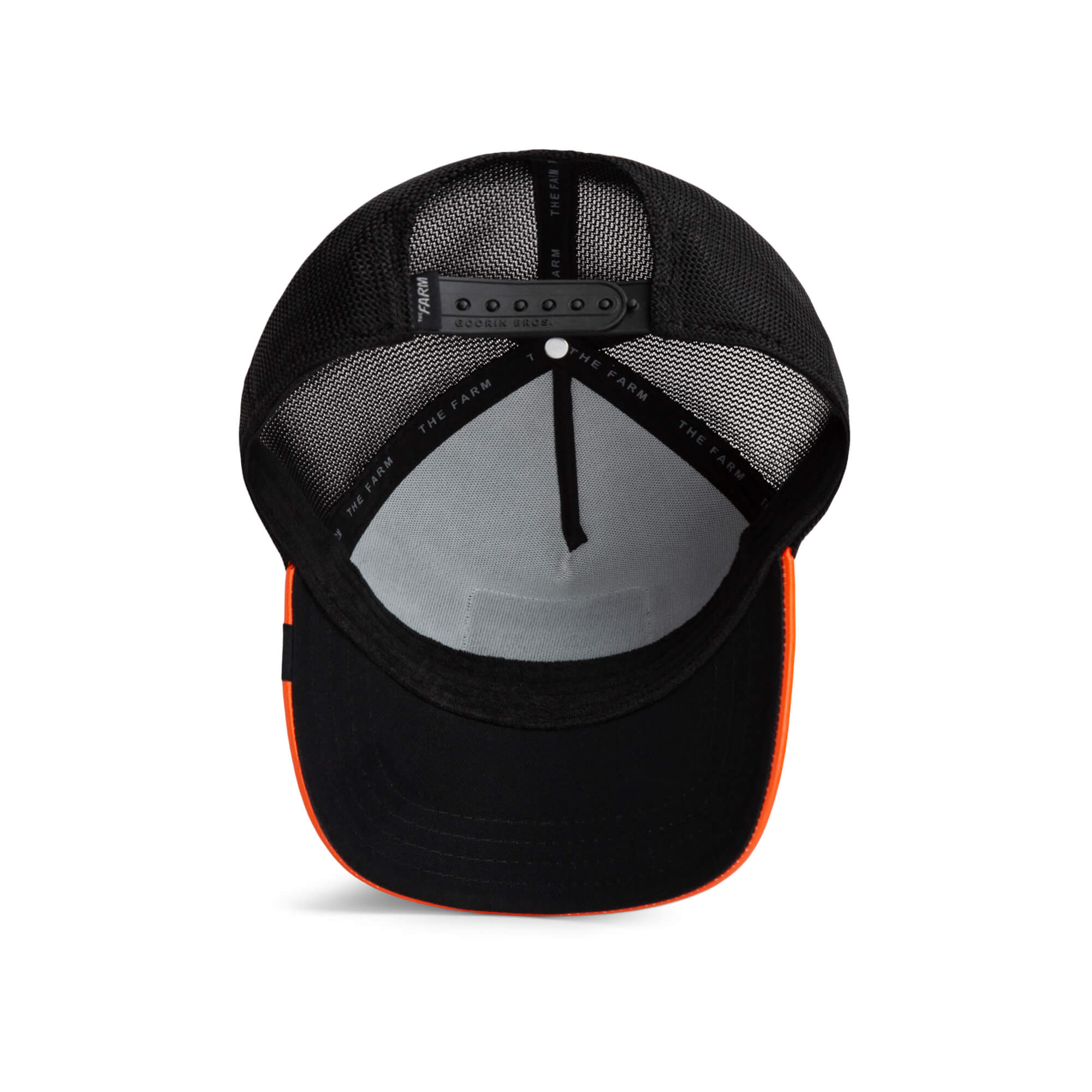 The Farm Shell Smoke black mesh snapback hat with an orange brim, shown from above to display the adjustable strap and interior details. All sales are final.