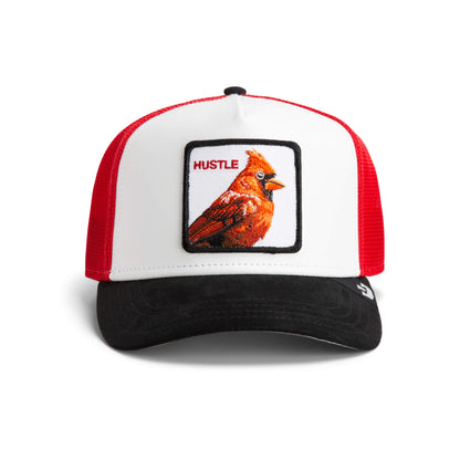 The Farm’s "TF is Bustle?" trucker hat features a red and white design, black brim, and a cardinal patch with “HUSTLE” on the front. All sales are final.
