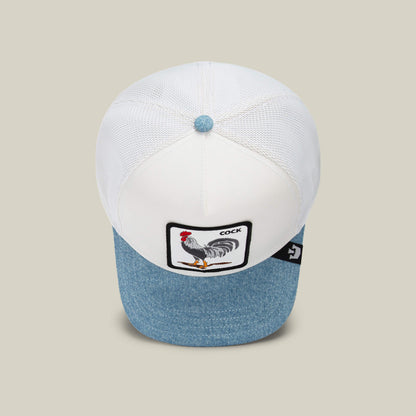 The Rooster Fan Institution Ball Club cap by Goorin Bros. features a bold rooster patch and "COCK" text on light denim with white mesh—your game-day essential.