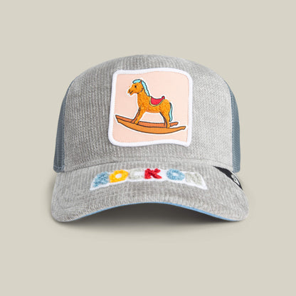 The Goorin Bros. Hobby Horse cap in SHADOW features a rocking horse patch on the front and “ROCKON” in colorful letters on the brim, blending streetwear style with nostalgic charm.