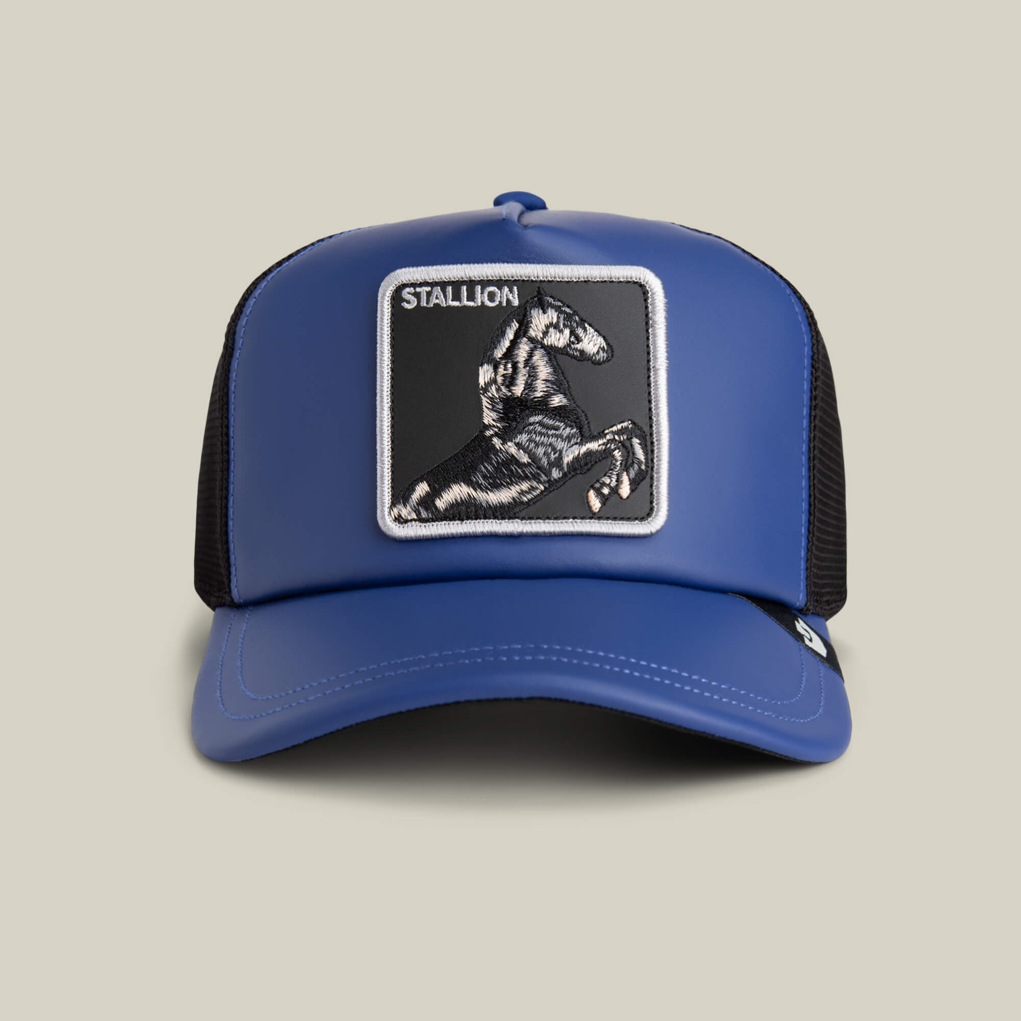 The Goorin Bros. LFG Stallion is a ROYAL blue trucker hat featuring a leather patch with an embroidered rearing horse and "STALLION" on the front, inspired by pre-game player exclusives.