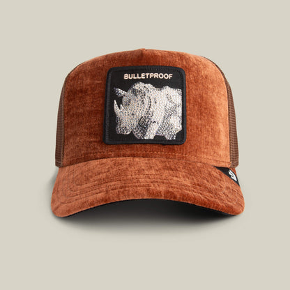 The Goorin Bros. "Iced Rhino" trucker hat in DESIRE features a front patch with a rhinoceros and BULLETPROOF in white—ideal for those who appreciate tank-like strength and standout style.