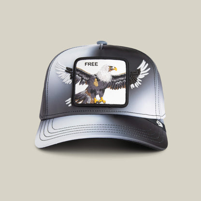 The Steal This Hat by Goorin Bros. is a black and white baseball cap featuring a bold bald eagle patch with "FREE" above it, adding a striking touch to your style.