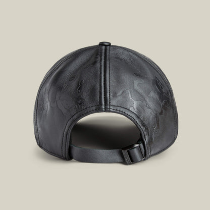 The "Put a Panther On It" cap by Goorin Bros. is shown from the back in black leather, featuring a classic fit, adjustable strap, and subtle embossed patterns on the surface.