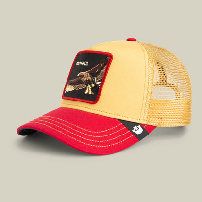 The Faithful Eagle by Goorin Bros. is a yellow and red trucker hat featuring a mesh back and a front patch with an eagle and the word FAITHFUL, celebrating loyalty in bold red and gold.