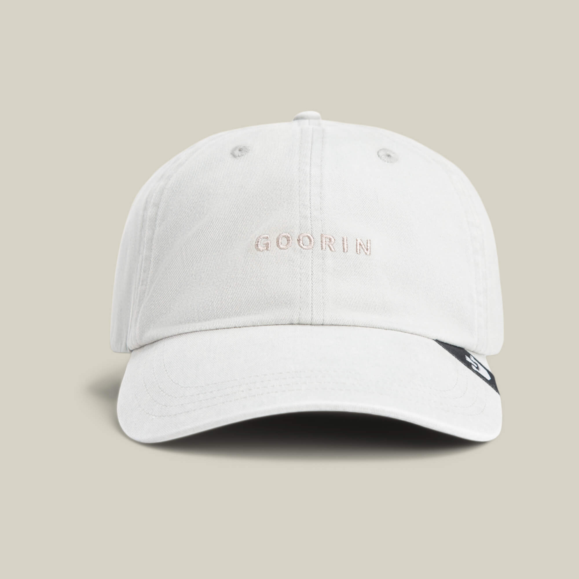 A light gray Papa Cap Italiano by Goorin Bros., featuring GOORIN embroidered on the front, displayed against a plain beige background.