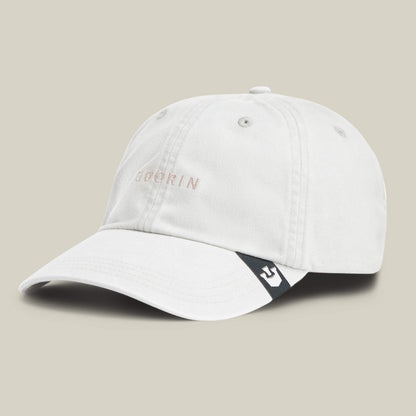 The Papa Cap Italiano by Goorin Bros. is a light grey vintage cap with "GOORIN" embroidered on the front and a small black and white tag on the brim, showcased against a plain background.