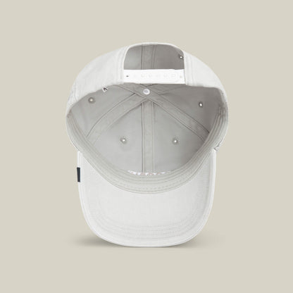 A light grey Goorin Bros. Papa Cap Italiano baseball cap is shown from the inside, featuring an adjustable snap closure and interior stitching details, set against a neutral background.