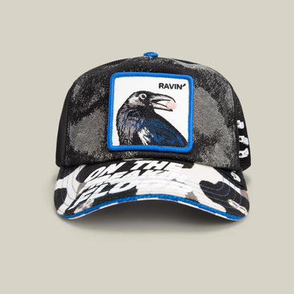 A black mesh Goorin Bros. Techno baseball cap with a raven patch, "RAVIN" text, and white graphic on the brim—ideal for raves or festival fashion—set against a plain background.