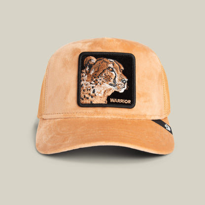 The Goorin Bros. Velour Cheetah cap in HEAT features a square patch with an embroidered cheetah head and WARRIOR text, inspired by swift movement and the bold spirit of the Velour Cheetah.