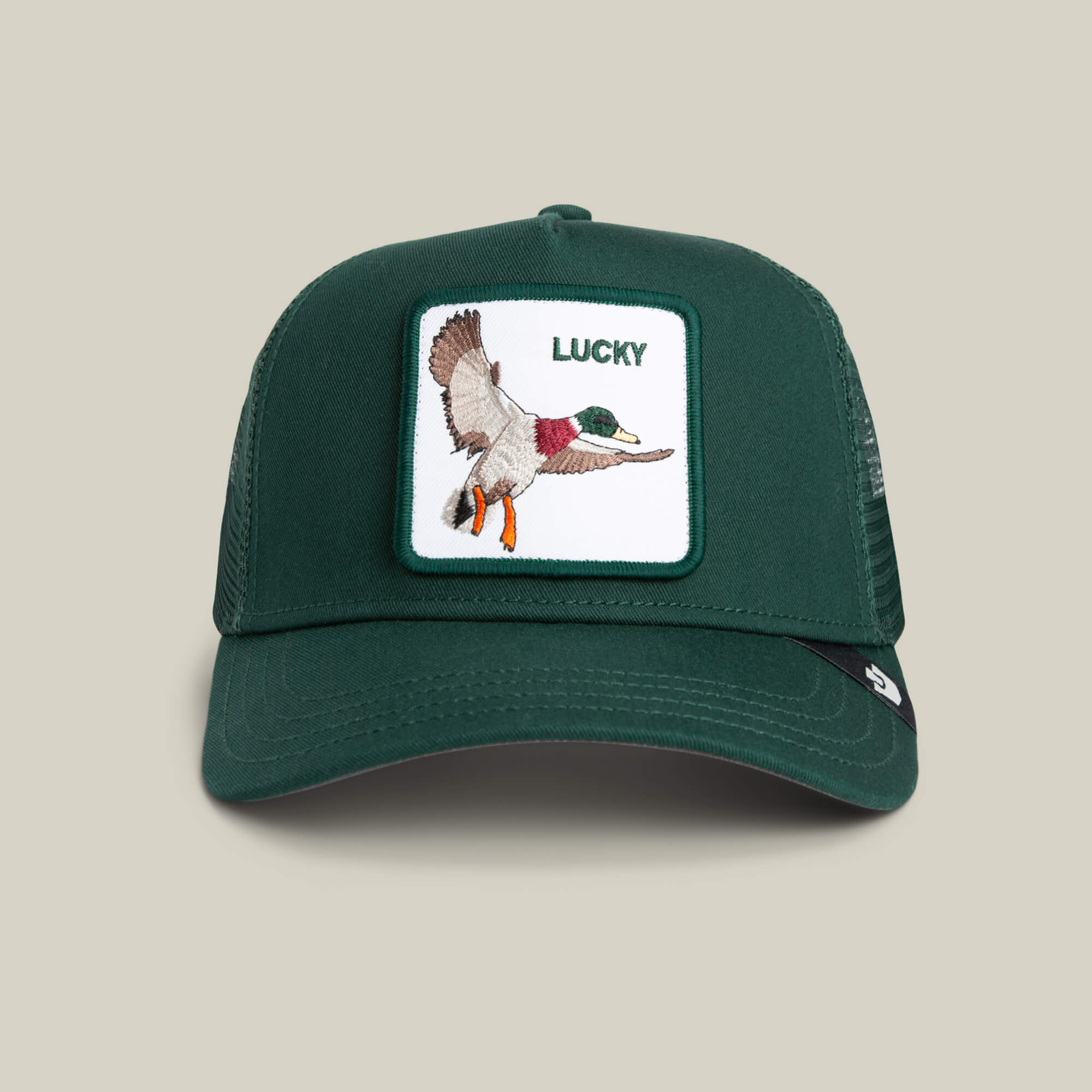 The Lucky Duck by Goorin Bros. is a green mesh trucker hat with a front patch showing an embroidered flying duck and "LUCKY" above it—your new good luck charm for any adventure.