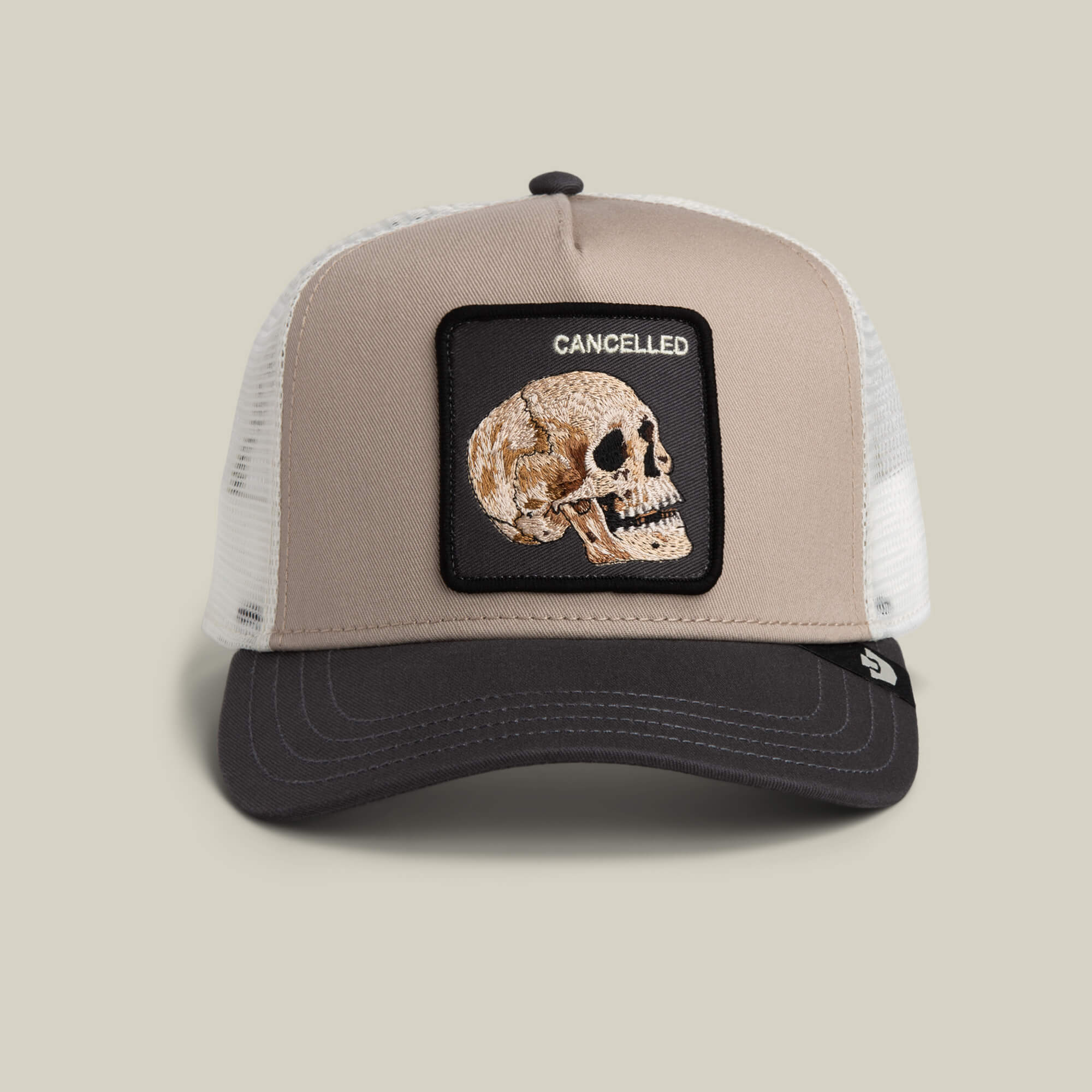 The Cancelled Skull by Goorin Bros. is a multi-color trucker hat with a stitched skull patch reading CANCELLED above it.