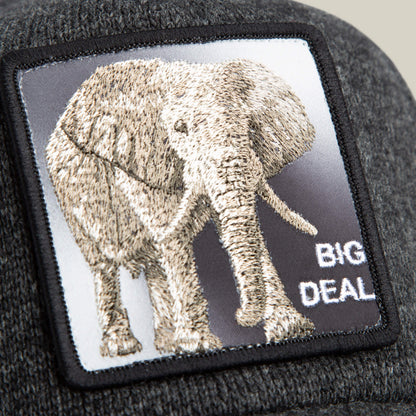 Close-up of a gray trucker beanie hat by Goorin Bros., called "Kind of," featuring an embroidered elephant, BIG DEAL text, and crafted from epic sweater material for ultimate comfort.