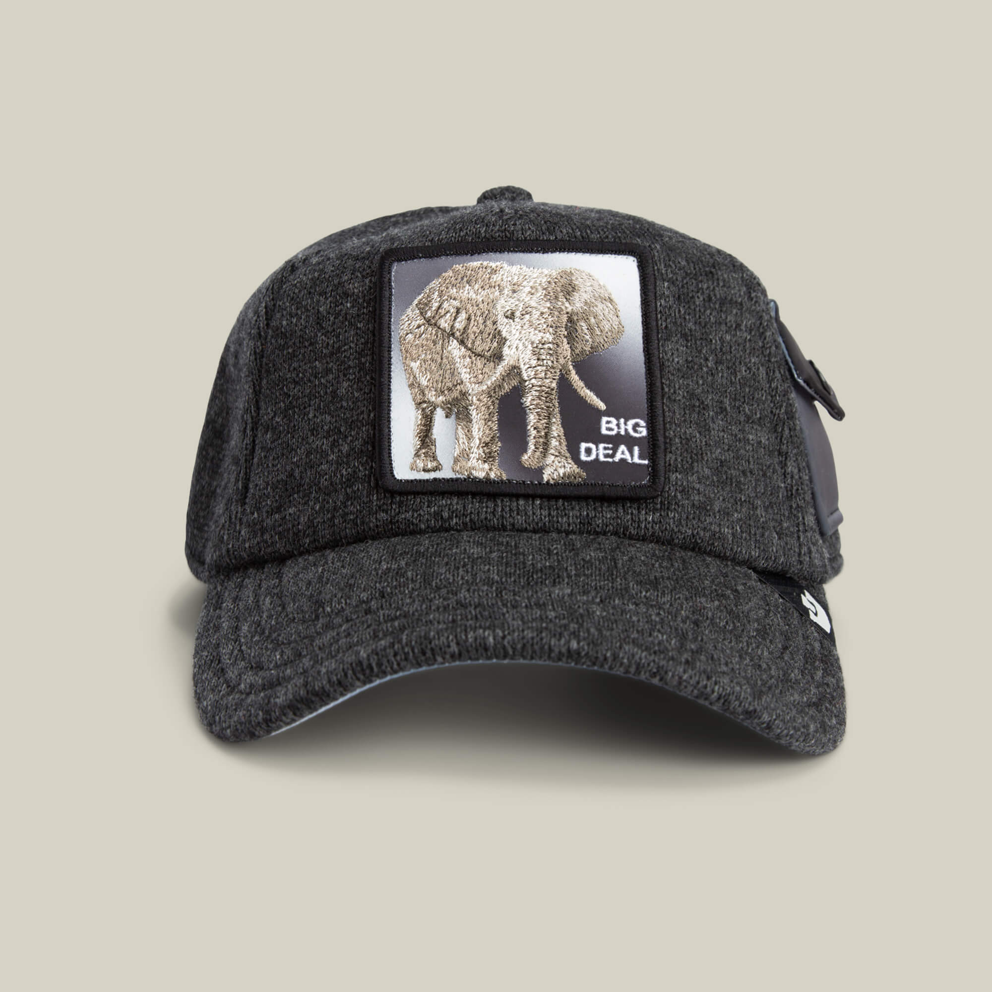 The Goorin Bros. "Kind of" baseball cap in OIL features a patch with an elephant and "BIG DEAL" on the front, set against a light beige background for a standout, feel-estate vibe.