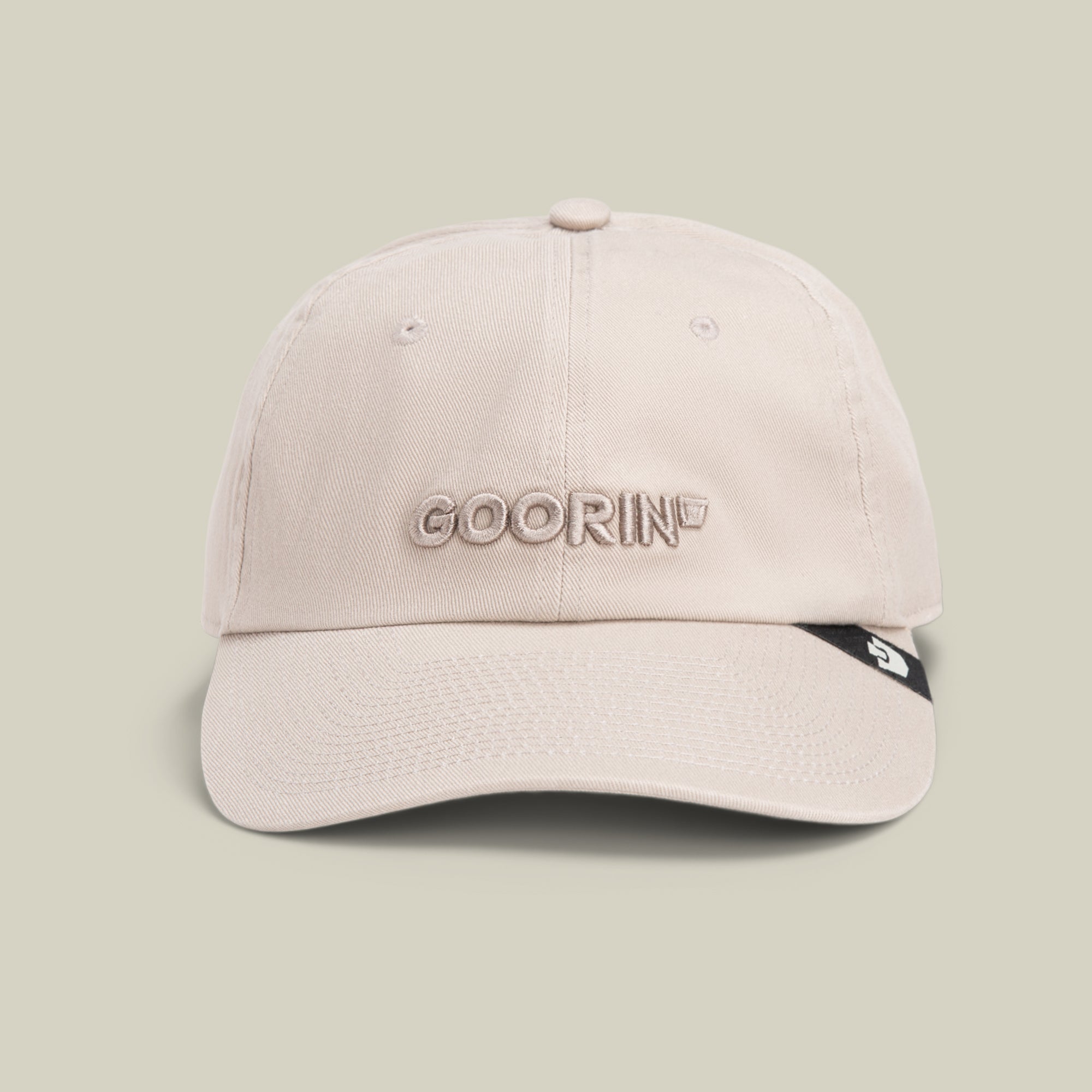 The Papa Core hat by Goorin Bros. features beige stitching, GOORIN embroidered on the front, and a small black tag on its curved brim, shown against a plain light background.
