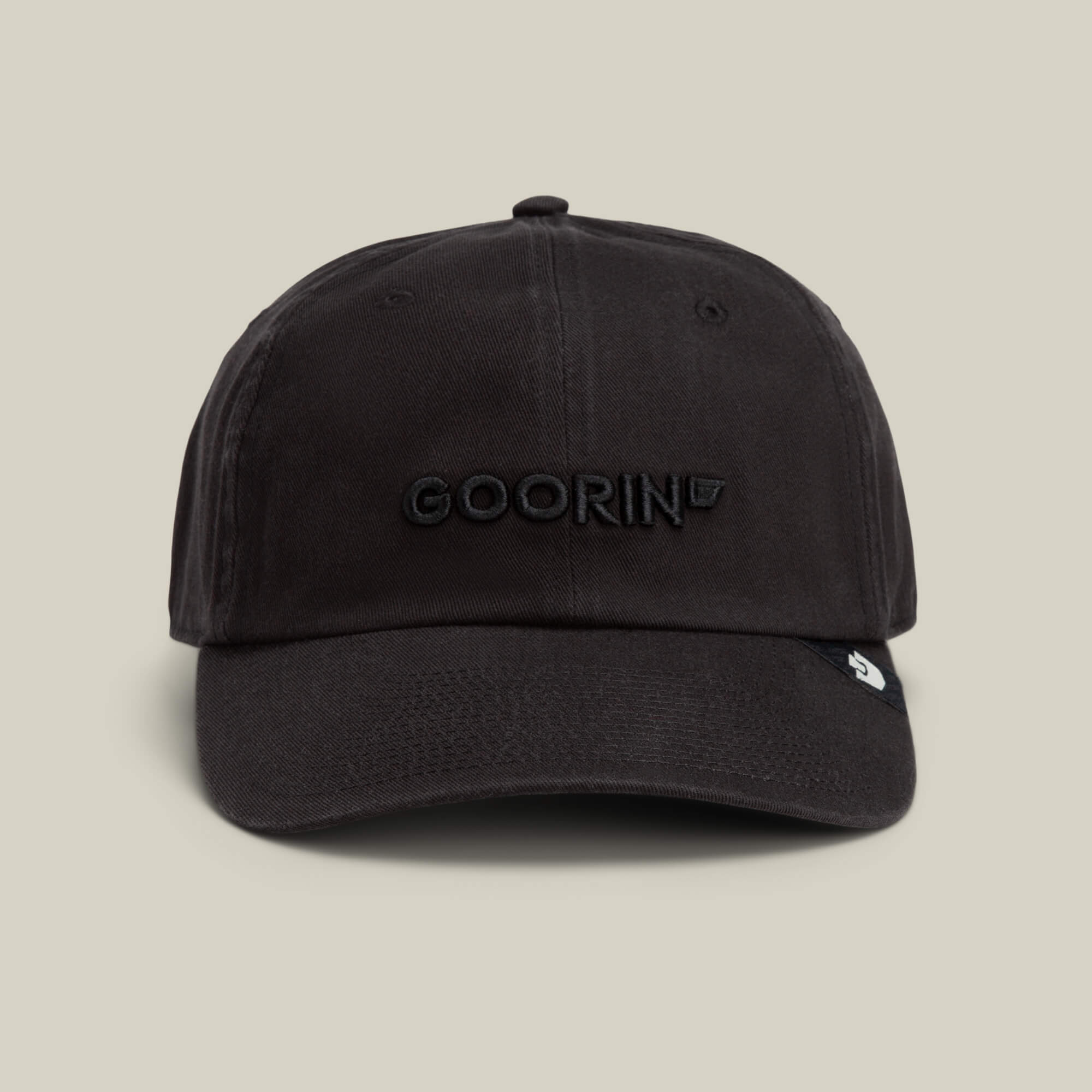 The Papa Core hat by Goorin Bros. is a black curved brim style with a soft crown and "GOORIN" embroidered in black on the front, shown against a plain beige background.