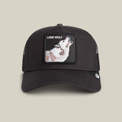 The Lone Wolf trucker hat by Goorin Bros. features mesh sides and a front patch with a howling wolf and "LONE WOLF" text—ideal for expressing your independent spirit.
