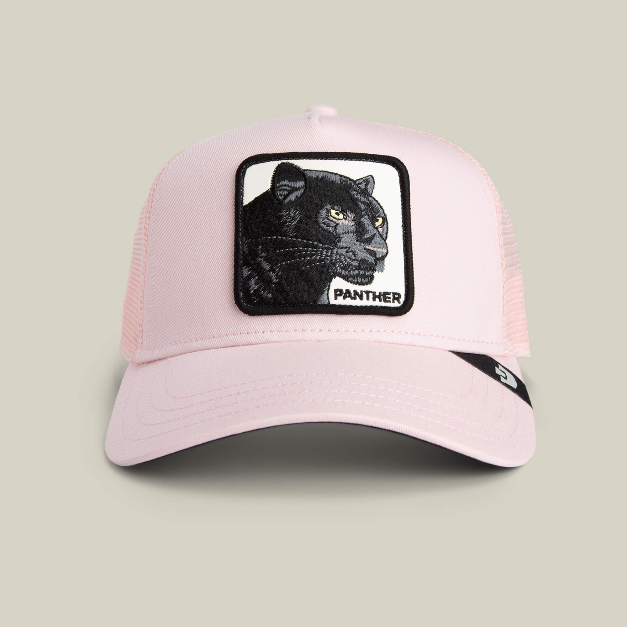 The Panther Trucker by Goorin Bros. is a light pink mesh hat with a rectangular patch featuring an embroidered black panther and "PANTHER" on the front—an ideal stylish addition to any collection.