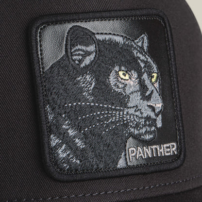 A close-up of The Panther by Goorin Bros., a black fabric patch with an embroidered panther featuring yellow eyes and "PANTHER" in white—ideal for adding bold style to any panther or black hat.