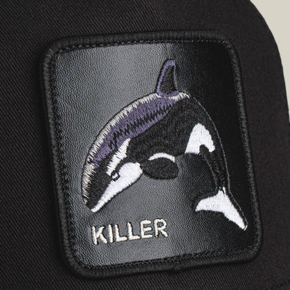 The Killer Trucker by Goorin Bros. sports an embroidered orca with "KILLER" stitched below on a black background—perfect for customizing your favorite black and white cap with bold, apex style.