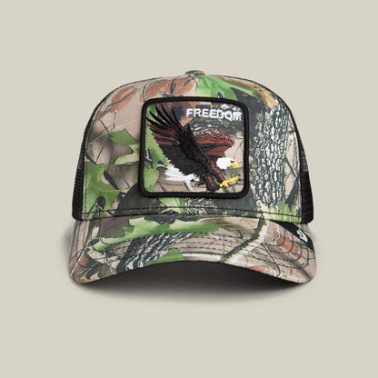 The Goorin Bros. Camouflage Eagle cap features a mesh back and a bold eagle patch with "FREEDOM," making it the perfect pick for fans of patriotic style.