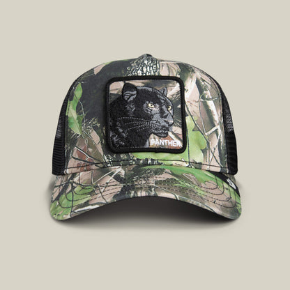The Goorin Bros. Camouflage Panther is a luxury baseball cap featuring a deep woods camo front, midnight-black embroidered panther patch, and black mesh back.
