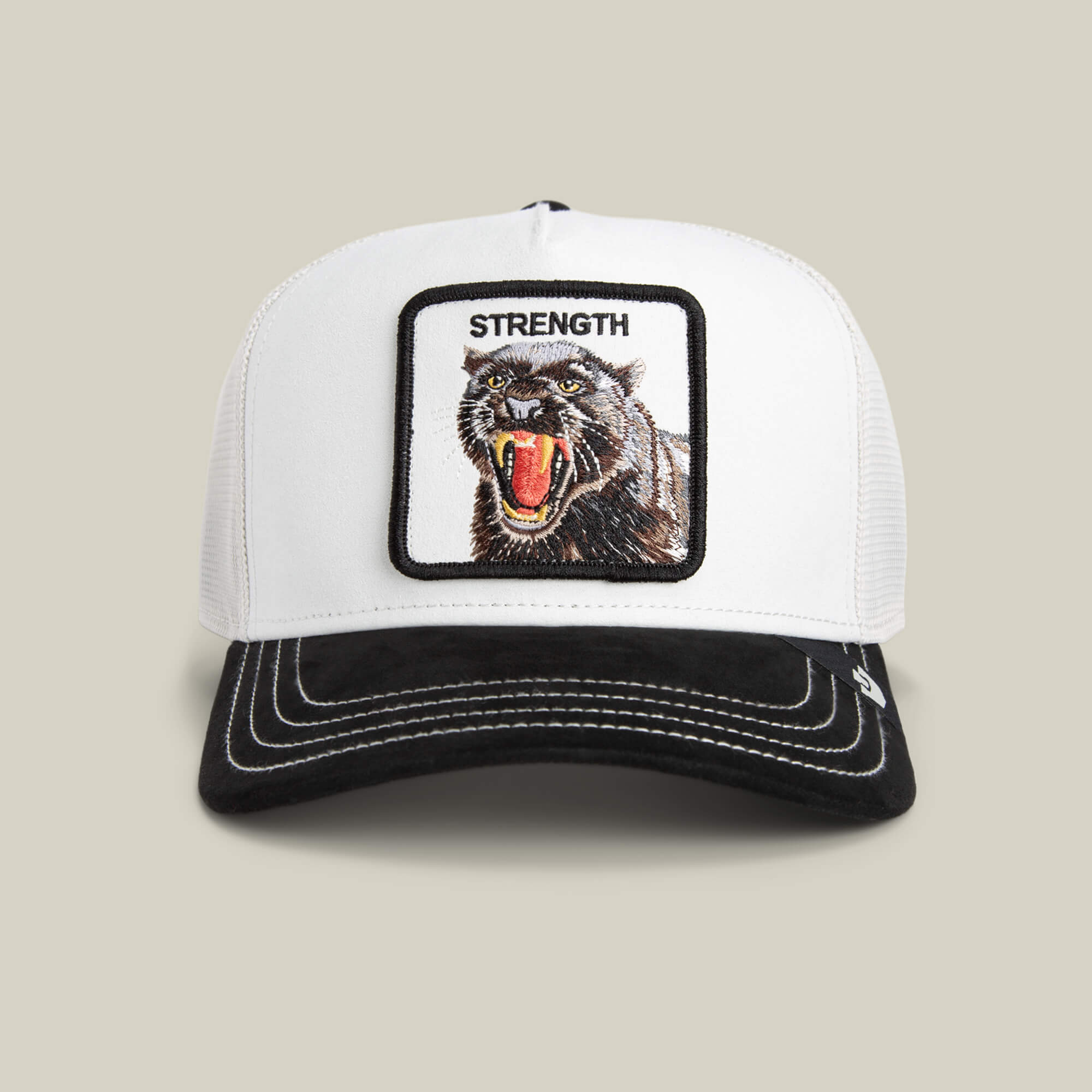 The Goorin Bros. Suede Panther hat features a bold white crown, black brim, and a striking panther patch with "STRENGTH" embroidered above the roaring cat.