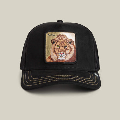 The Goorin Bros. Golden King cap is a black baseball hat with beige stitching, featuring an embroidered lion's face and "KING" patch on the front—celebrating the Golden Lion with a touch of golden shine in every detail.