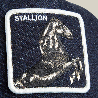 The Goorin Bros. Denim Stallion patch features a black and white embroidered horse with “STALLION” in white on a dark blue fabric—perfect for adding arena style to your favorite cap.