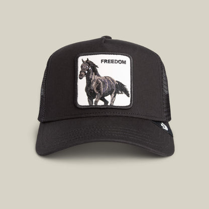 The Goorin Bros. Freedom Horse hat is a black mesh trucker cap with an embroidered black horse and "FREEDOM" patch on the front—ideal for expressing your wild spirit on the open road.