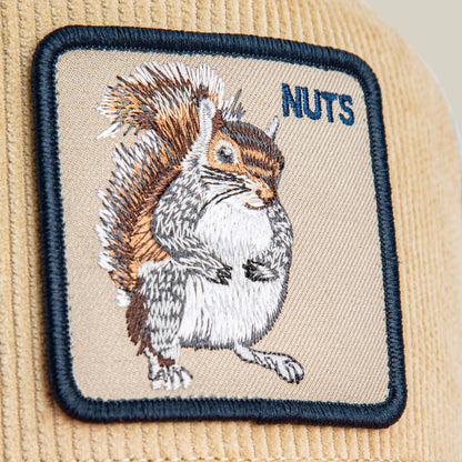 A beige corduroy patch with an embroidered squirrel and "NUTS" in blue thread adds forest flair to the Goorin Bros. Nuts Remix hat.