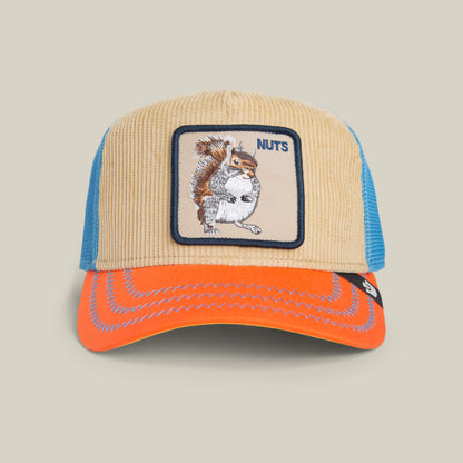Add forest flair to your look with the Goorin Bros. Nuts Remix trucker hat—tan corduroy, electric blue mesh, orange brim, and a patch of a squirrel holding a nut with “NUTS” embroidered on the front.