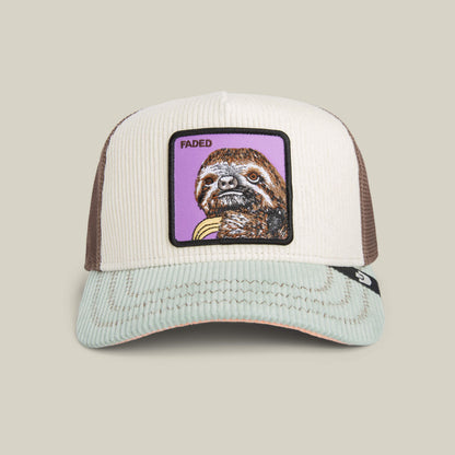 The Goorin Bros. Faded Remix hat features cream corduroy with beige and brown tones, a mesh back, and a sloth patch with "FADED" on the front for a relaxed, casual style.